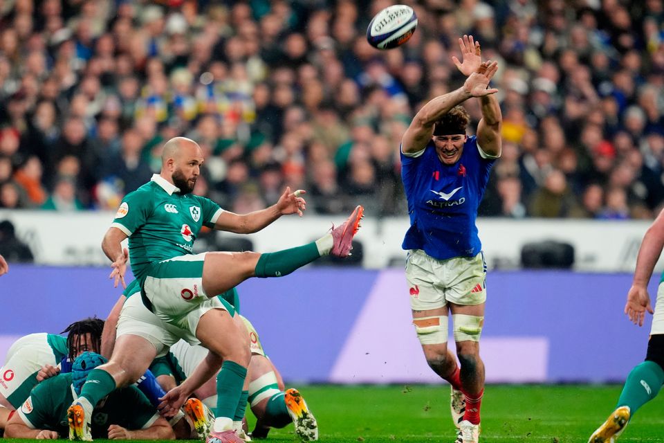 Kick, kick and kick it high again: Jamison Gibson-Park clears the ball against France in Paris. Photo: Adam Davy/PA Wire