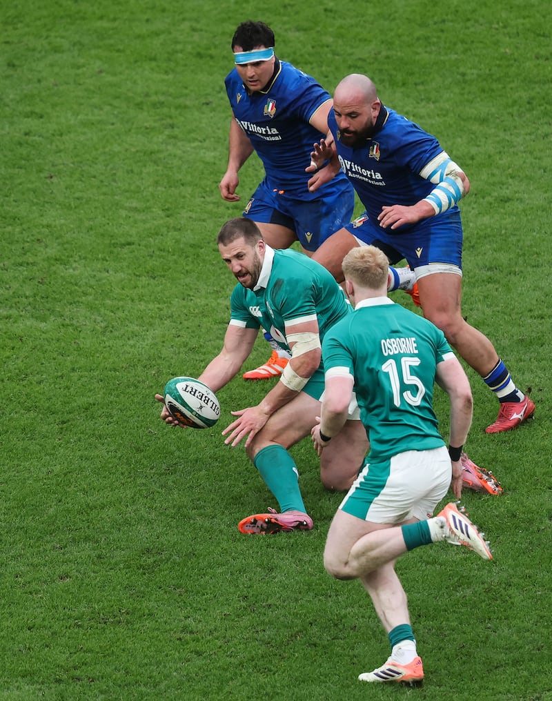 Stuart McCloskey passes to Jamie Osborne during the game against Italy. Photograph: Inpho