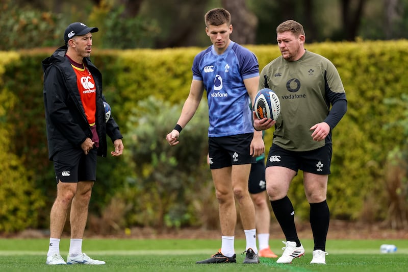 Backs Coach Andrew Goodman with Sam Prendergast and Tadhg Furlong. Photograph: Ben Brady/Inpho