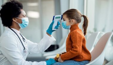 Hospital corridor with paediatric care signage during influenza season, representing paediatric influenza hospitalisations after COVID-19.