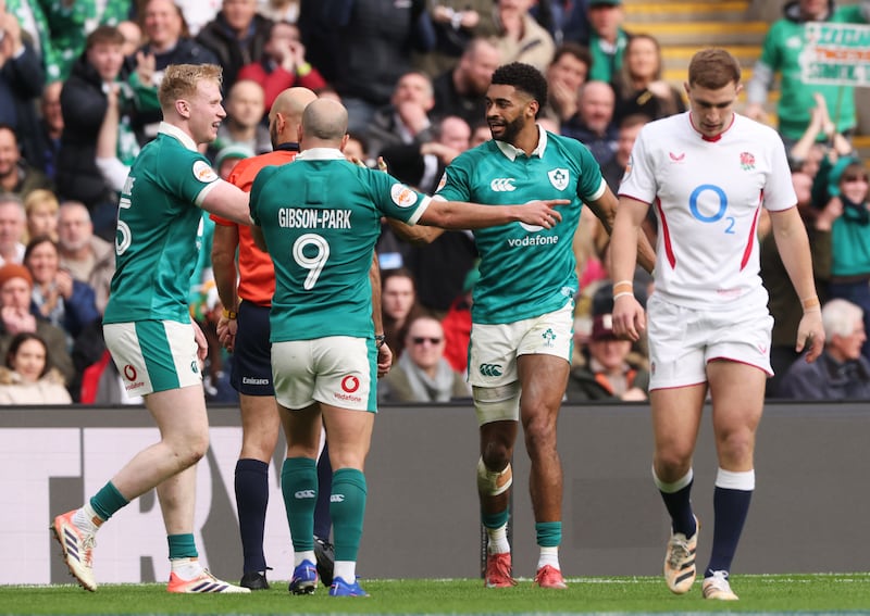 Ireland's Robert Baloucoune, Jamie Osborne and Jamison Gibson-Park celebrate a try. Photograph: David Rogers/Getty Images
