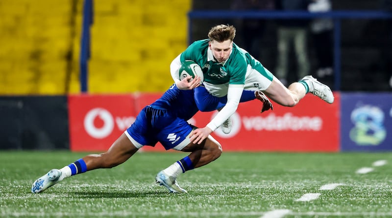 Ireland's Daniel Ryan is tackled by Malik Faissal of Italy. Photograph: Nick Elliott/Inpho