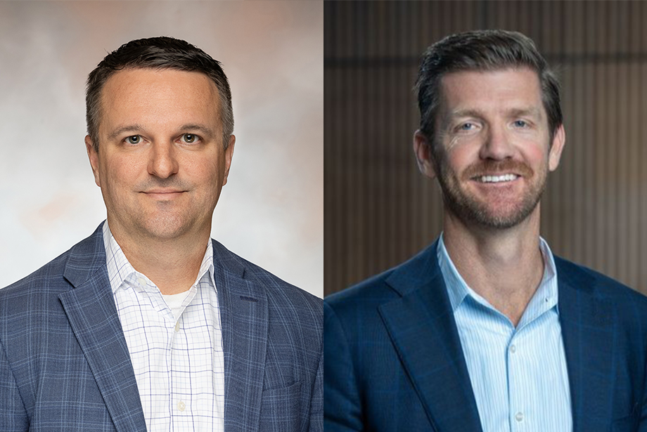 A photo showing Brian Jackson and Jonathan Schneider, each wearing suit jackets and button-down shirts