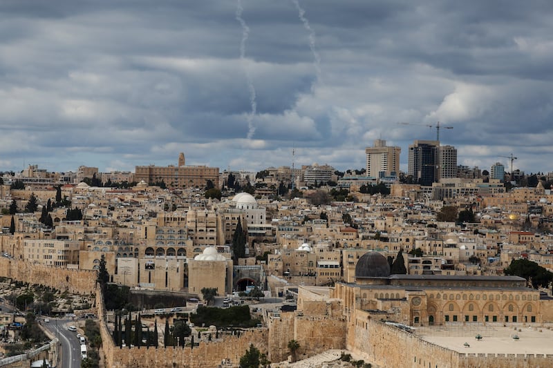 Rocket trail from Israel's Iron Dome missile defence system is seen over the skies of Jerusalem on Saturday. Photograph: Ahmad Gharabli/AFP via Getty Images