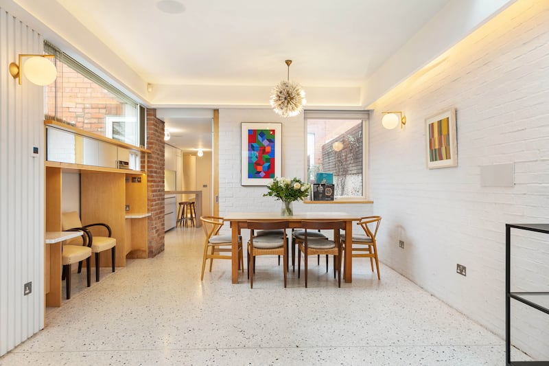 Extension has terrazzo flooring and a nook to the left of the image to accommodate a piano