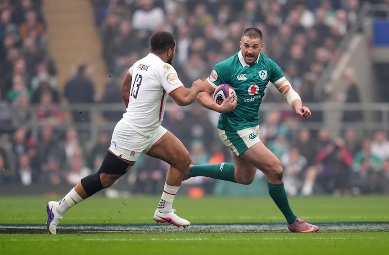 Stuart McCloskey takes on England's Ollie Lawrence. Photograph: Adam Davy/PA