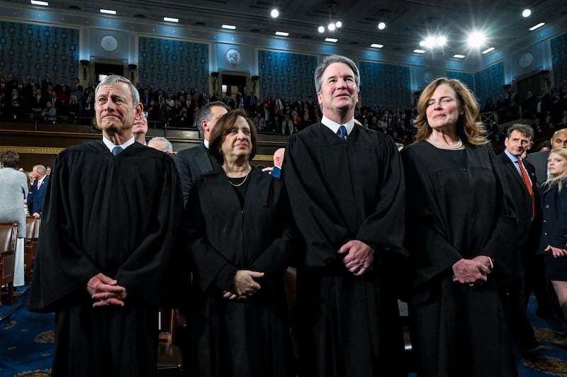 From left: Supreme Court chief justice John G Roberts Jr, justice Elena Kagan, justice Brett Kavanaugh and justice Amy Coney Barrett stand at their seats ahead of Donald Trump’s address at the Capitol. Photograph; Kenny Holston/the New York Times
                      