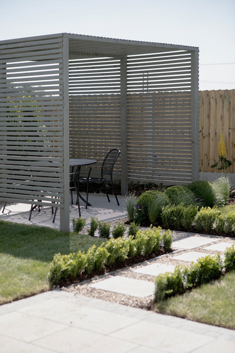 Pergola designed by Optimise Design in the garden of a new-build home