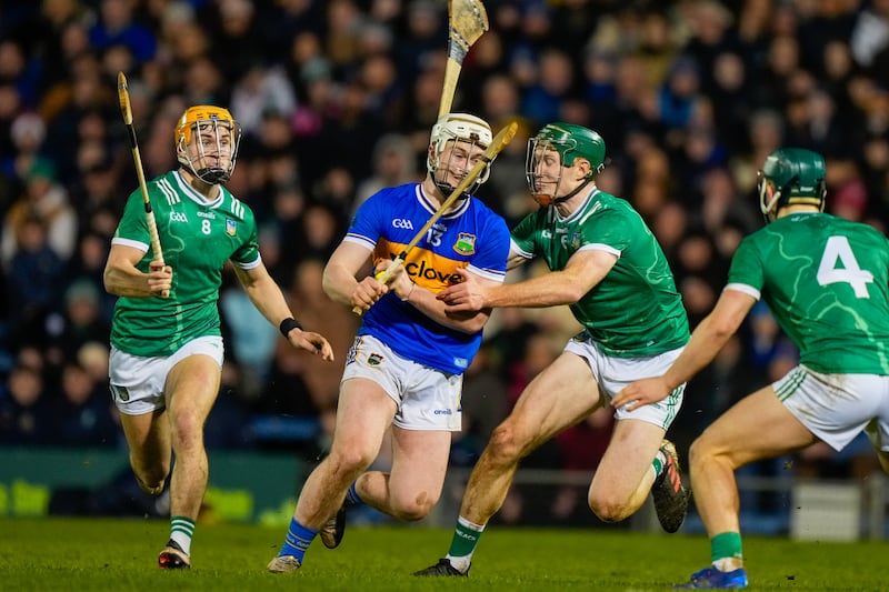 Tipperary's Darragh McCarthy is tackled by Limerick's William O'Donoghue. Photograph: James Lawlor/Inpho