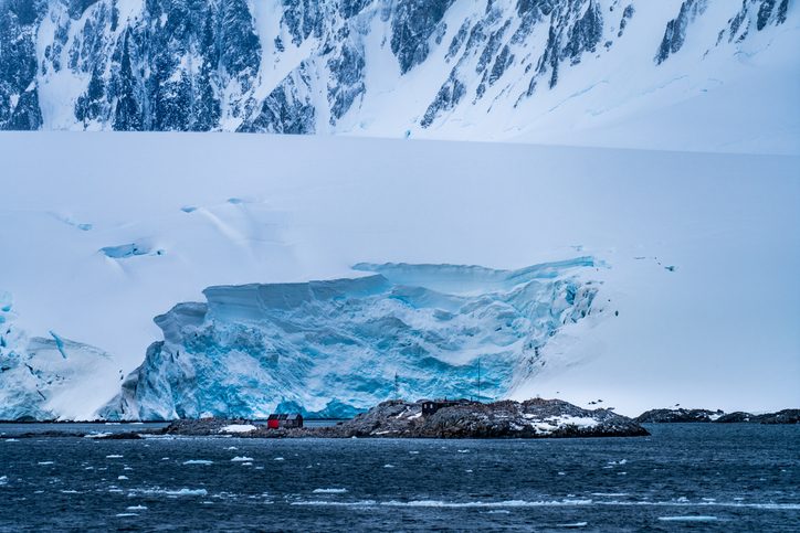 Port Lockroy is a bay with a natural harbour on the north-western shore of Wiencke Island in the Palmer Archipelago, Antartica. The base with the same name, on Goudier Island is the most southerly post office in the world.