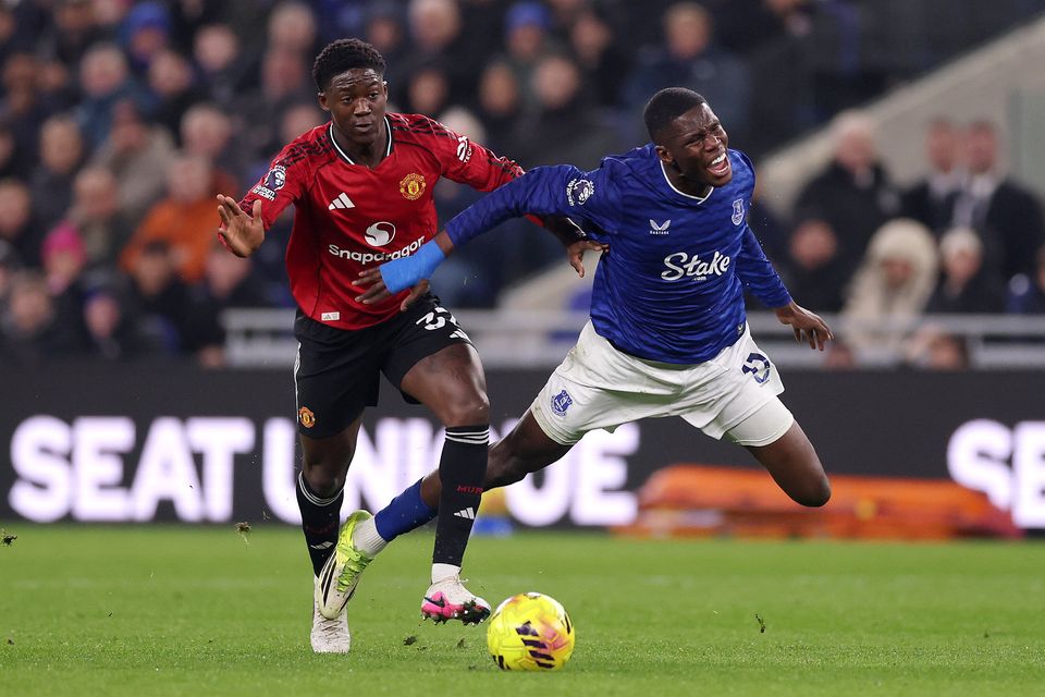Everton's Thierno Barry is challenged by Manchester United's Kobbie Mainoo at the Hill Dickinson Stadium. Photo: Getty