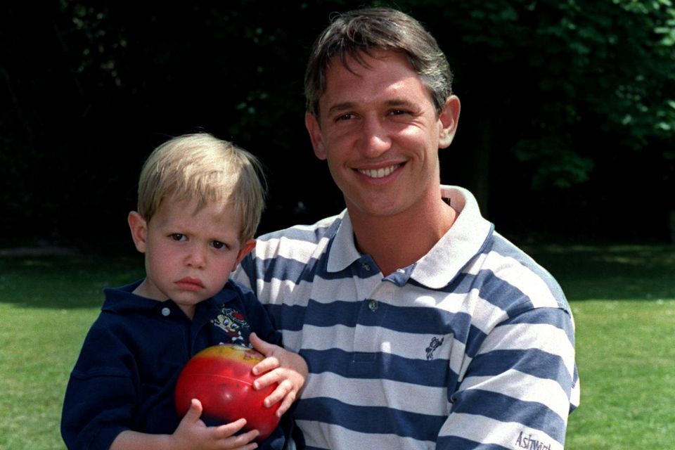 Former England striker Gary Lineker holding his son George  (Photo by Matthew Ashton/EMPICS via Getty Images)