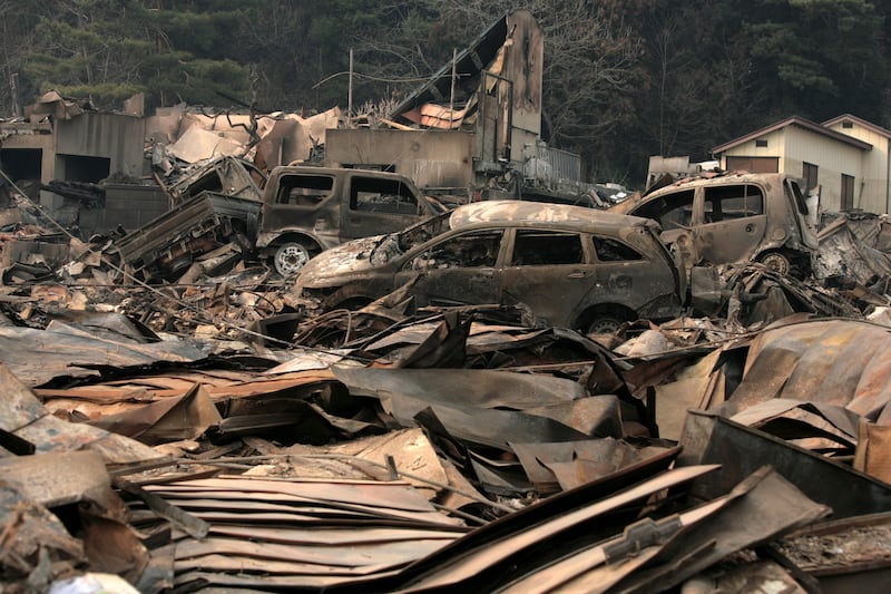 What is left of the city after a tsunami wiped away the gas station, which caused a fire and burnt down the whole town. Photograph: Toshiharu Kato/Japanese Red Cross/IFRC via Getty