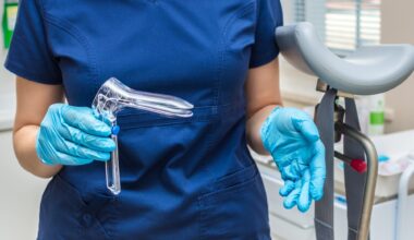 Gynecologist holding a gynecological speculum with gloves