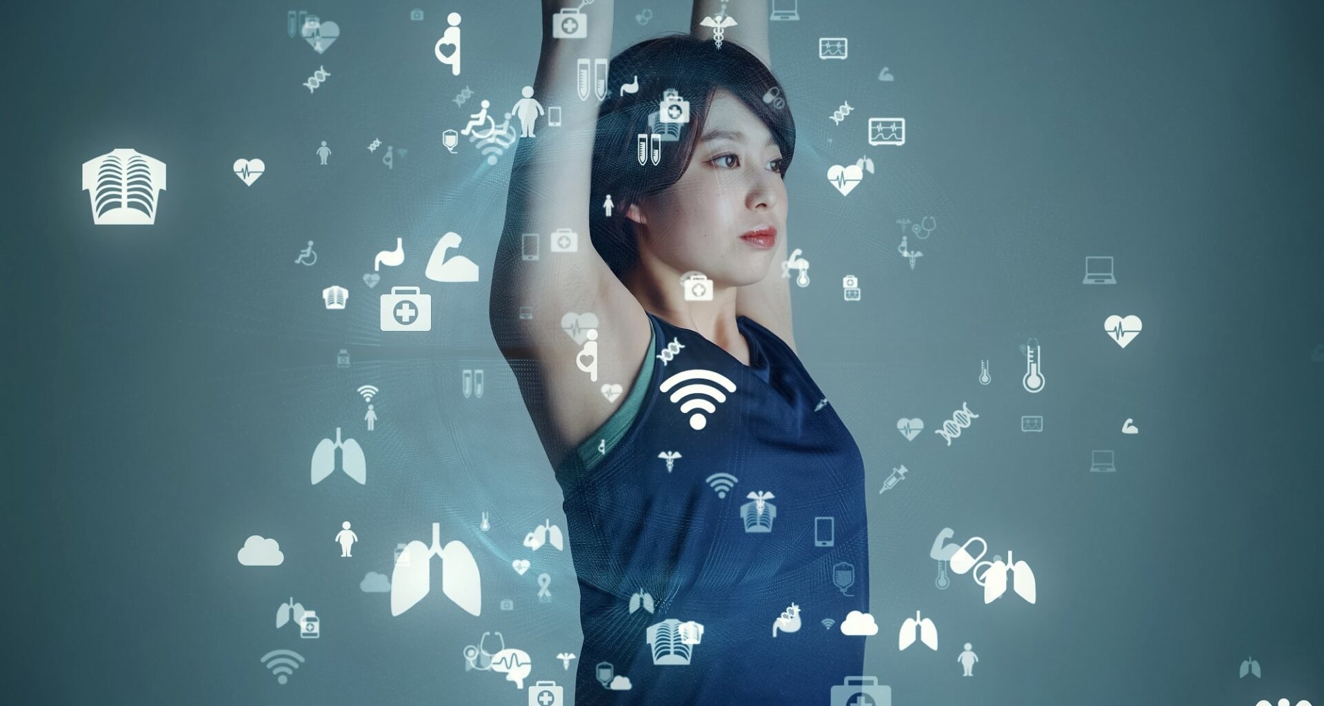 Woman raising her arms with digital health and wearable sensor icons overlaid, illustrating smart textiles and motion tracking technology.