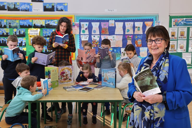 23/11/2022 - TICKET - CHILDRENS LAUREATE.Aine Ní Ghlinn who is the children’s laureate, with some irish language books,  also in picture is Ruth Ní Eidhin, project manager and some students at Scoil Naithi in Ballinteer , Dublin.Photograph: Dara Mac Dónaill / The Irish Times
