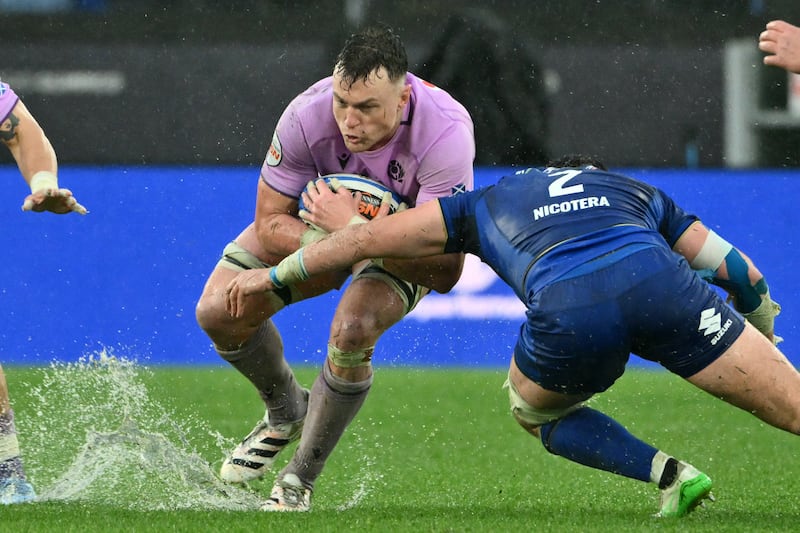 Scotland's Jack Dempsey is tackled by Italy's Giacomo Nicotera during Saturday's Six Nations match at a soaked Stadio Olimpico in Rome. Photograph: Alberto Pizzoli/AFP via Getty Images