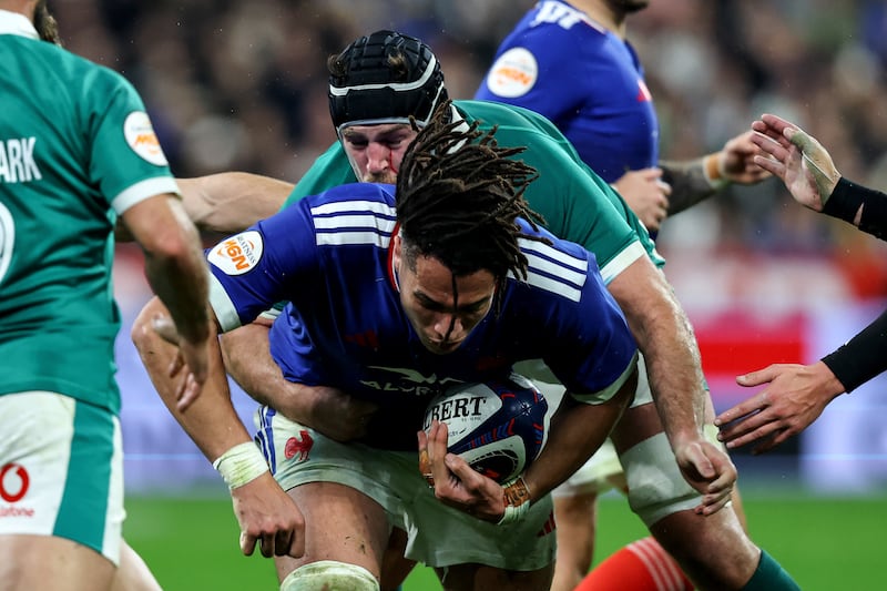 Ireland's Caelan Doris tackles Mickael Guillard of France. Photograph: Ben Brady/INPHO