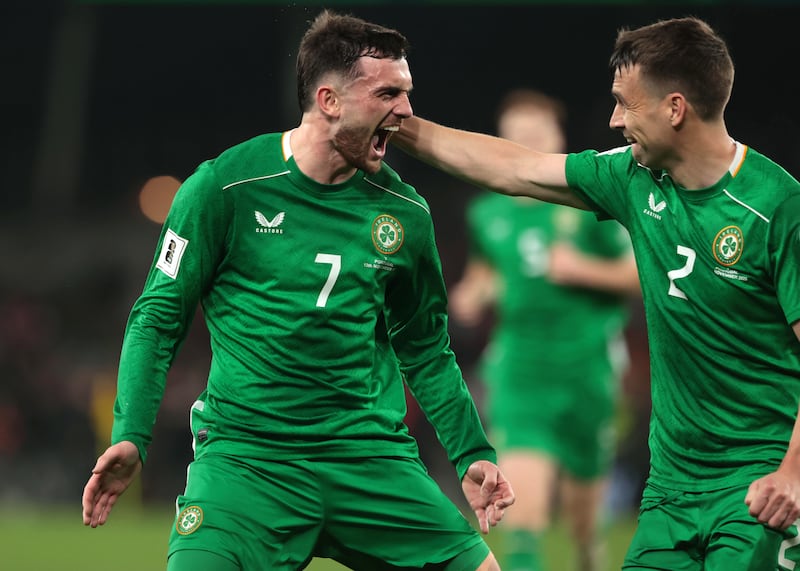 Troy Parrott celebrates with Seamus Coleman after scoring against Portugal in last year's World Cup qualifier. Photograph: Liam McBurney/PA