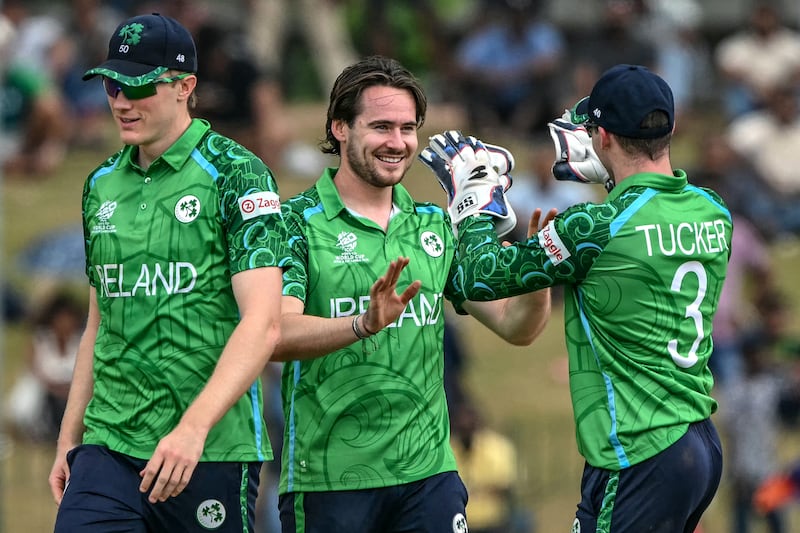 Ireland's Josh Little (C) celebrates with teammates after taking the wicket of Oman's Mohammad Nadeem. Photograph: Ishara S. KODIKARA/AFP via Getty Images