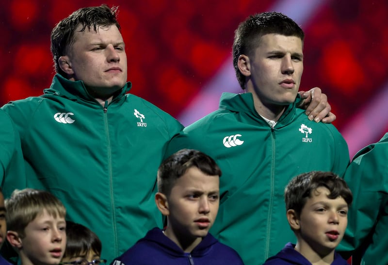 Ireland's Cian Prendergast and Sam Prendergast stand for the national anthem. Photograph: Ben Brady/Inpho