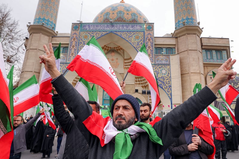 Protesters gather with Iranian national flags during a demonstration in support of the government and against US and Israeli strikes outside a mosque in Tehran on Saturday. Photograph: Atta Kenare/AFP via Getty Images