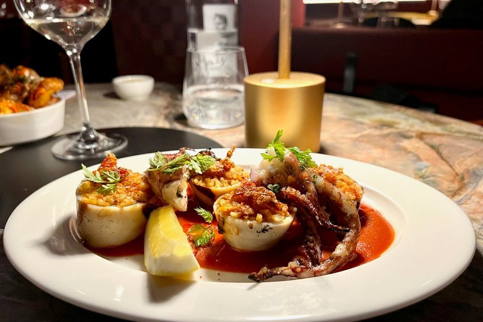 Squid stuffed with pigtail arroz cebolla on sobrasada sauce. Photo: Lucinda O’Sullivan