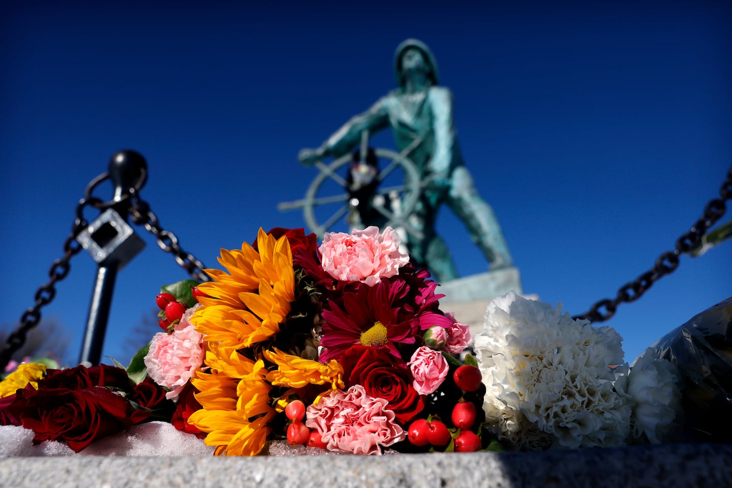 Flowers rested Saturday at the Fisherman's Memorial in Gloucester.