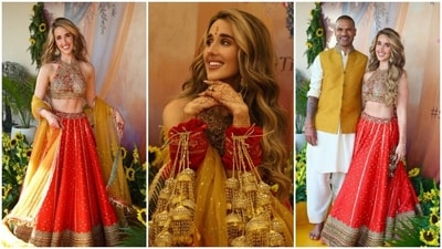 Sophie Shine, fiancée of Indian cricketer Shikhar Dhawan, looks elegant in a red and gold traditional lehenga. (Instagram/ sophieshine93)