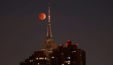 The blood-red full Beaver Moon passes behind the Empire State Building during a total lunar eclipse on November 8, 2022