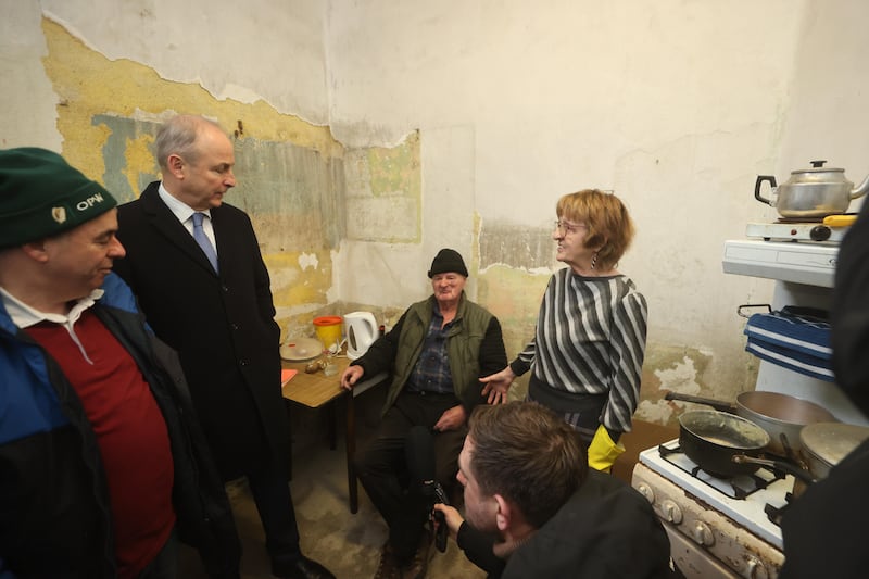 Taoiseach Micheál Martin meets Maryellen McNamara (right) and John McNamara (centre) who's home was damaged in the recent flooding during a visit to on Island Road in Co Wexford. Photograph: Liam McBurney/PA Wire