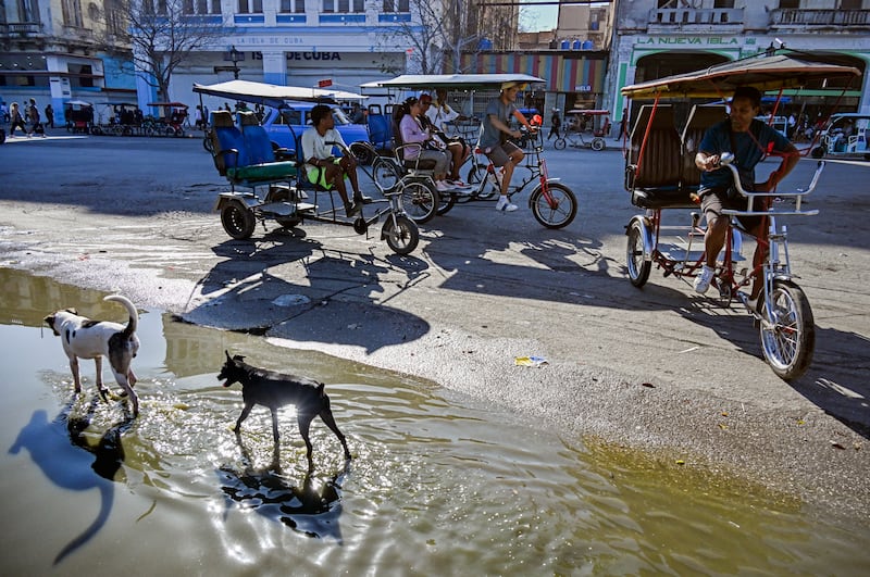 The fuel crisis in Cuba is forcing many workers turn to reply on electric tricycles and bicycle taxis. Photograph: Yamil Lage/AFP/Getty Images