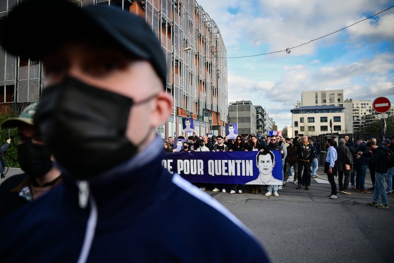Protesters hold a banner during a march in tribute to far-right activist Quentin Deranque, who died after being attacked on the sidelines of a far-right protest in Lyon last week. Photograph: Olivier Chassignole/AFP via Getty Images