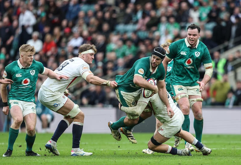 Ireland's Caelan Doris is tackled by England's Alex Coles tackles. Photograph: Inpho