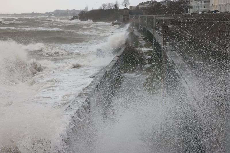Waves crash over Blackrock dart station.