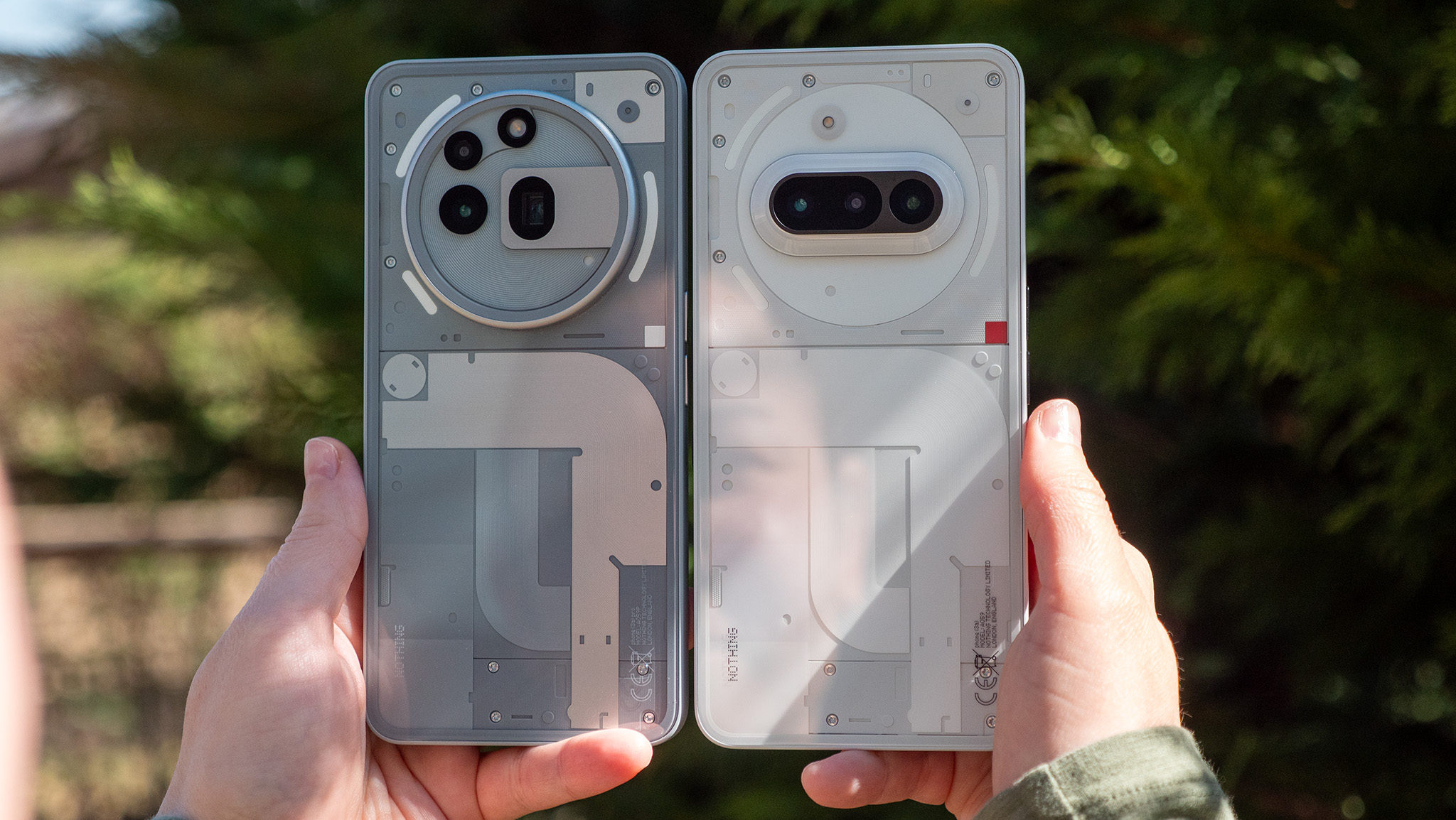 Comparing the transparent backs of the grey Nothing Phone (3a) Pro with the white Nothing Phone (3a)