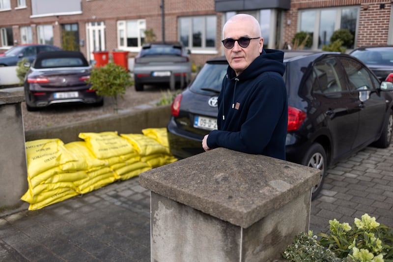 Clontarf Road resident Joe McDonagh with council-issued sandbags for flood protection. Photograph: Chris Maddaloni