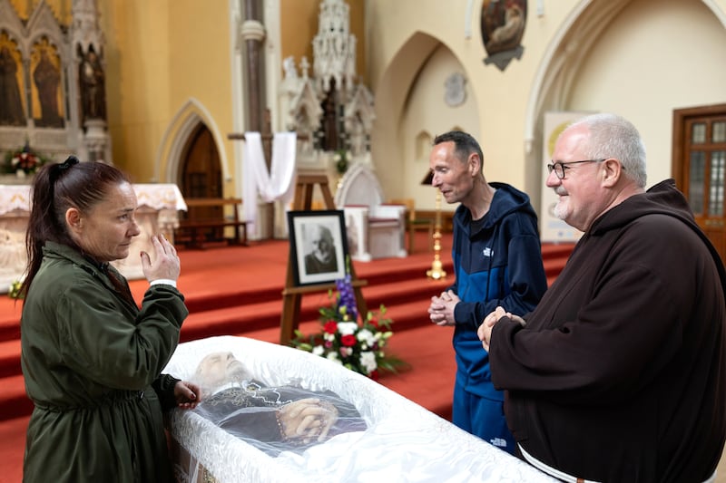 Sarah Foran, Damien Devereux and Fr Kevin Kiernan pay their respects to Br Kevin Crowley at St Mary of the Angels, Capuchin Friary, Dublin.  Photograph: Tom Honan