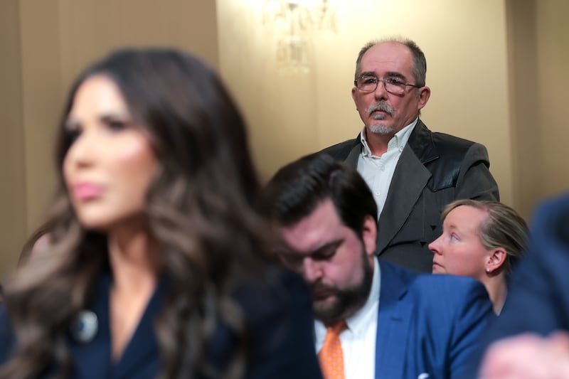 Jim Brown (back right), husband of Donna Hughes Brown, listens as US secretary of homeland security Kristi Noem testifies before a congressional committee on homeland security in Washington, DC in December. Photograph: Anna Moneymaker/Getty