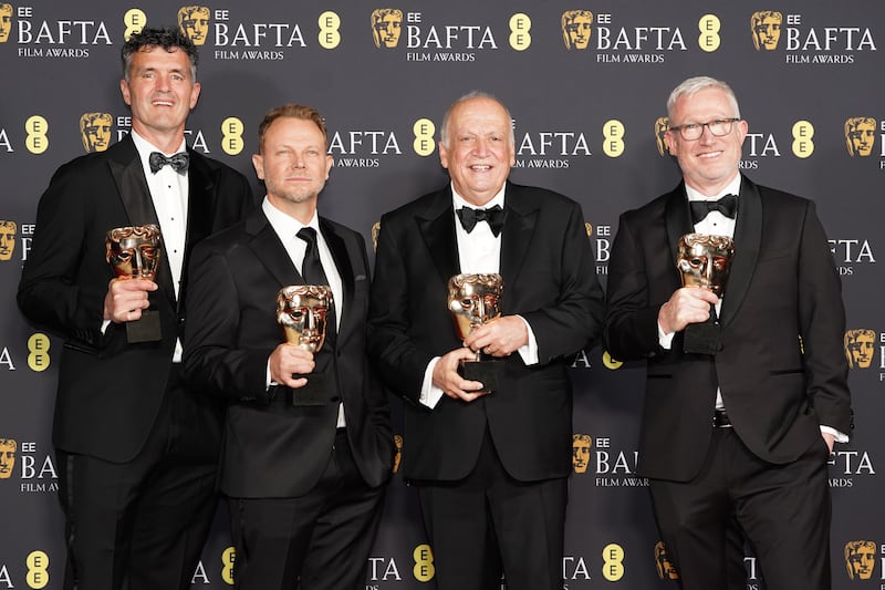 From left: Eric Saindon, Richard Baneham, Joe Letteri and Daniel Barrett pose with their awards after winning Best Special Visual Effects for Avatar: Fire And Ash. Photograph: Ian West/PA Wire