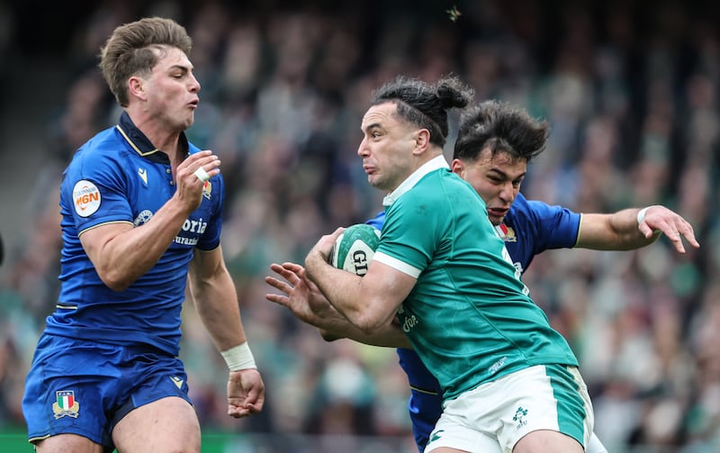 Ireland's James Lowe is tackled by Italy's Leonardo Marin and Lorenzo Pani. Photograph: Inpho