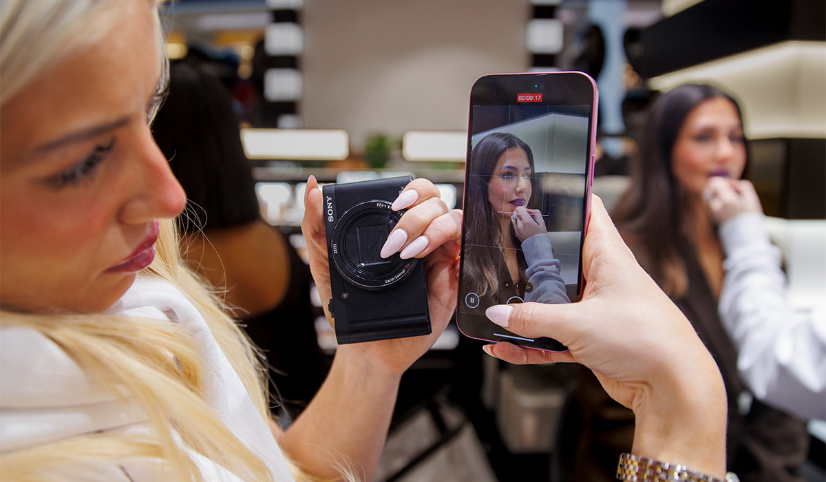 Eva Corbett from Wonderskin takes a video of Brogan O'Neill at the opening of the new Sephora UK store in Belfast's Victoria Square. The 2,550 sq ft store is Sephora's 13th shop in the UK, and the first to open the island of Ireland. Pic: Liam McBurney/PA Wire