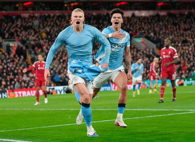 Late Erling Haaland penalty keeps Man City in title race as match ends in chaos against Liverpool at Anfield