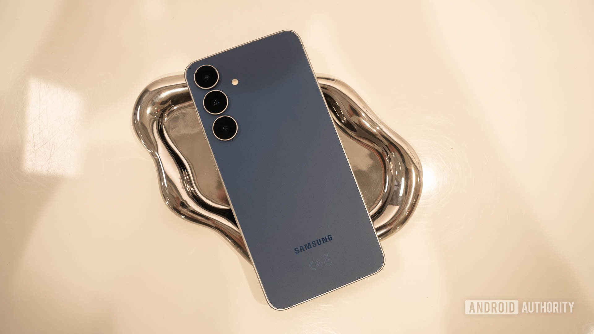 Samsung Galaxy S25 FE in Navy on silver tray