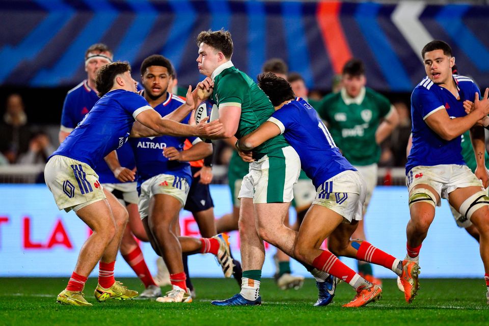 James O'Leary of Ireland is tackled by Melvyn Rates and Luka Keletaona of France during the U20 Six Nations match at Stade Amie Giral in Perpignan, France. Photo: Brendan Moran/Sportsfile