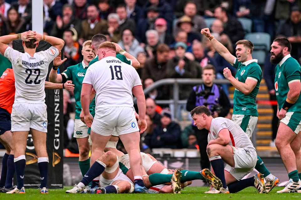 Jack Crowley of Ireland, right, celebrates at the full-time whistle during the Six Nations win over England at Twickenham. Photo by Ramsey Cardy/Sportsfile
