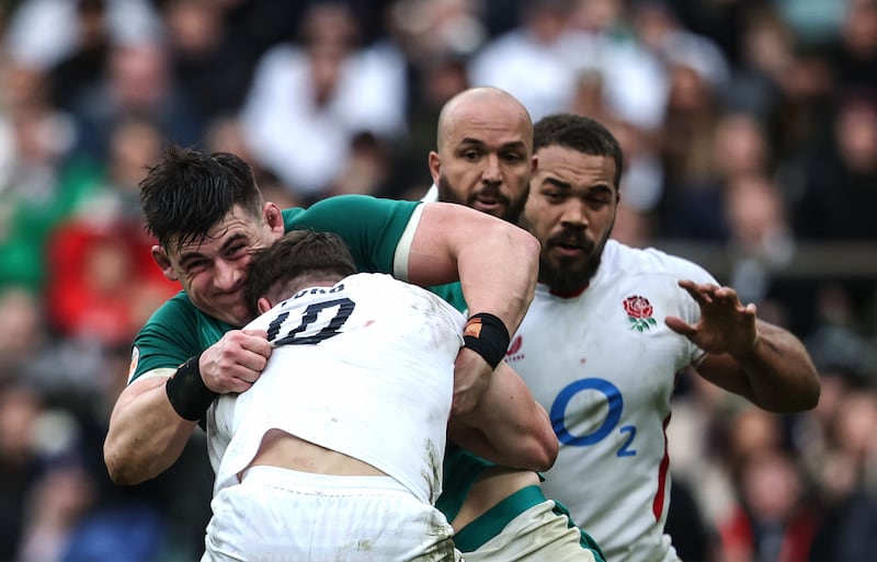 England's George Ford is tackled by Ireland's Dan Sheehan. Photograph: Inpho