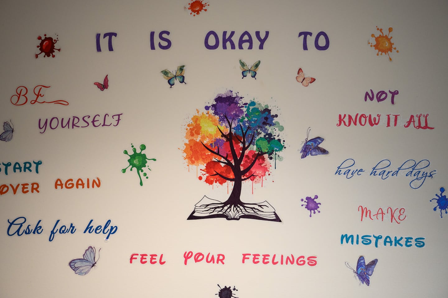 A decal with affirmations decorated a wall near the entrance of a mental health clinic in Somerville High School on Jan. 21.