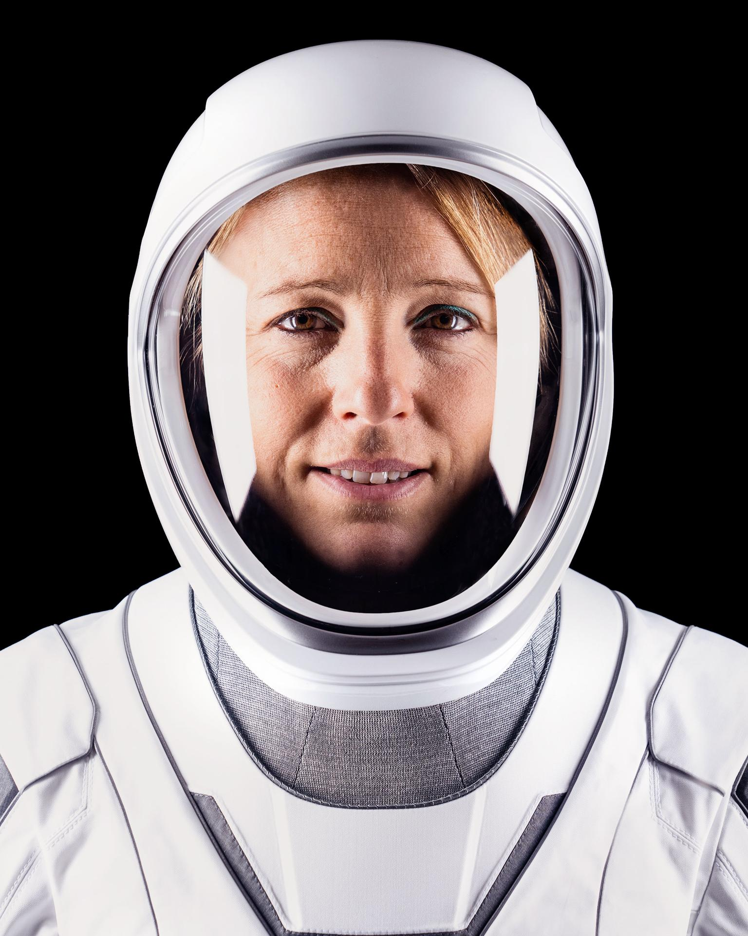 A person in a white spacesuit.