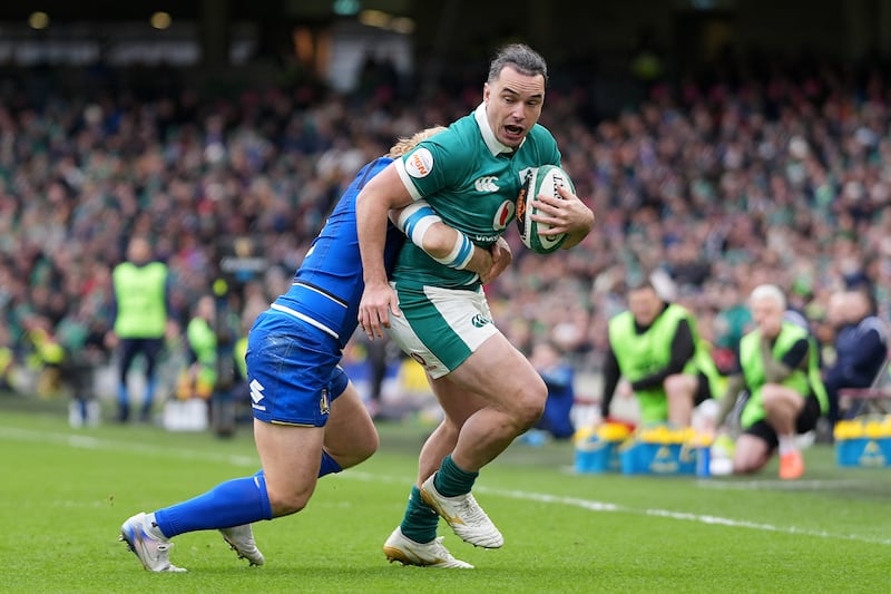 Ireland's James Lowe (right) is tackled by Italy's Louis Lynagh. Photograph: Niall Carson/PA